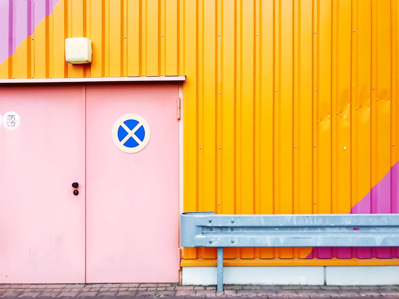 yellow, wall - building feature, architecture, no people, day, sign, communication, door, closed, entrance, built structure, building exterior, multi colored, outdoors, metal, pink color, protection, human representation, garbage bin, safety, iron