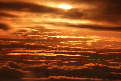 Low angle view of cloudy sky at sunset