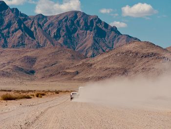 Scenic view of mountain road against sky