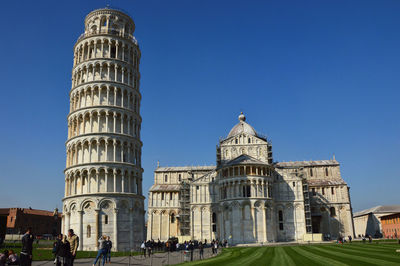 Low angle view of historical building against blue sky