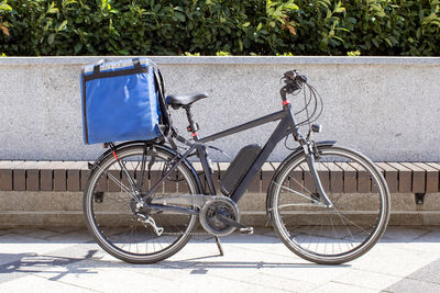 Electric bicycle for delivery parked outdoors