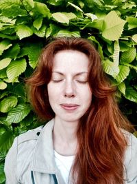 Portrait of young woman with eyes closed