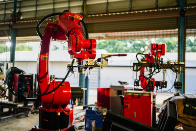 Close-up of robot arms in factory.