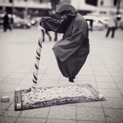 Woman standing on sidewalk