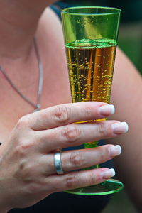 Close-up of woman hand holding drink