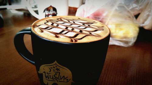 Close-up of cappuccino on table