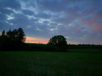 Scenic view of field against sky during sunset