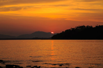 Scenic view of sea against romantic sky at sunset