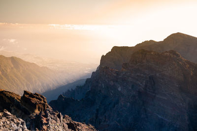 Scenic view of mountains against sky during sunset