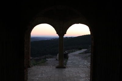 Scenic view of sea against sky seen through arch