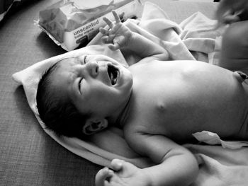 Close-up of baby sleeping on bed