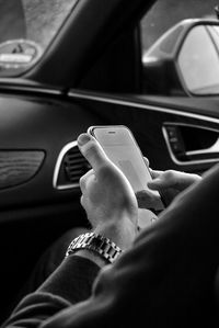 Cropped image of woman driving car