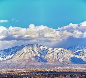 Scenic view of snowcapped mountains against sky