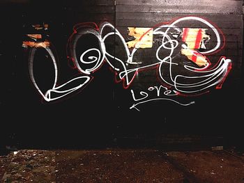 Graffiti on wall at night