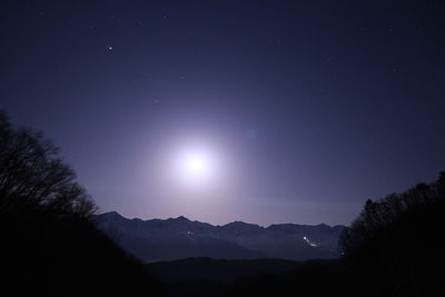 Scenic view of landscape against sky at night