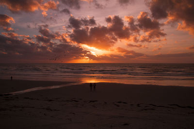 Scenic view of beach during sunset