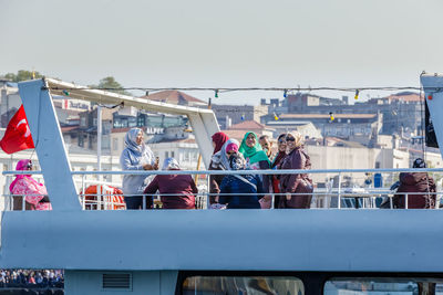 Group of people in front of bridge