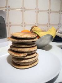 Close-up of stack of fruit in plate on table