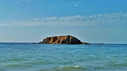 Scenic view of sea against blue sky