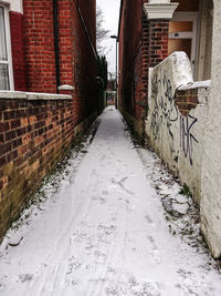 Cobblestone street amidst buildings