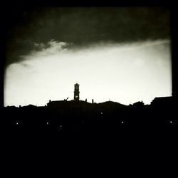 Low angle view of silhouette church against sky