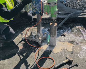 Low section of man working at construction site