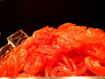 Close-up of orange flowers against black background