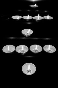 Close-up of illuminated candles on table