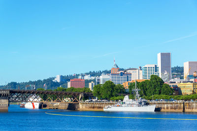 Calm river with buildings in background