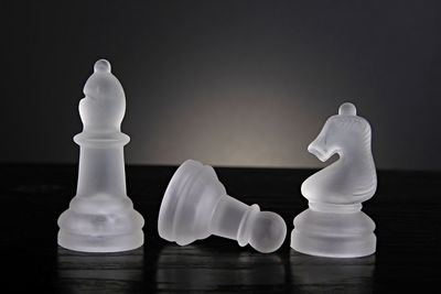 Close-up of chess pieces against white background