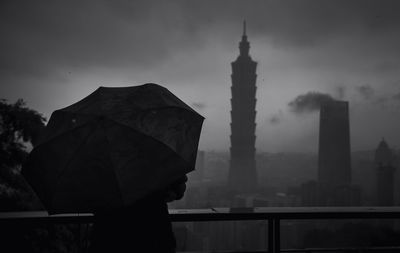 View of buildings against cloudy sky