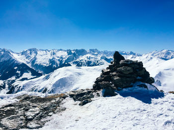 Scenic view of mountains against cloudy sky