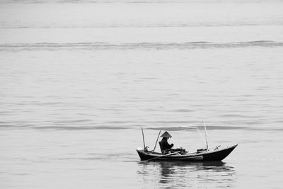 Man kayaking on sea