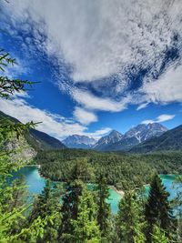 Scenic view of lake and mountains against sky