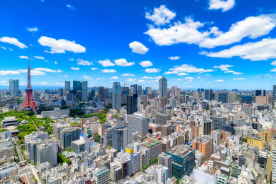 High angle view of modern buildings in city against sky