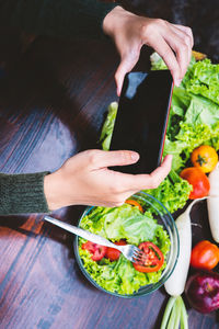 High angle view of person preparing food on table