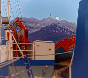 Scenic view of the snowy peak of etna volcano with moon setting