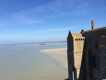 Scenic view of sea against blue sky