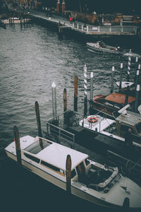 High angle view of boats moored at harbor