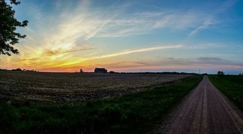 Road passing through field