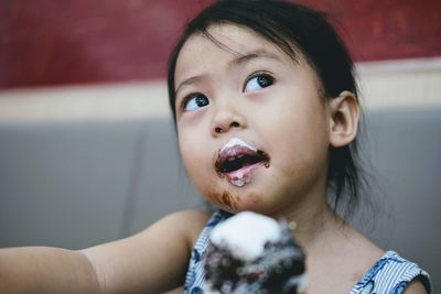 Close-up of girl eating ice cream