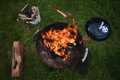 High angle view of barbecue grill on field