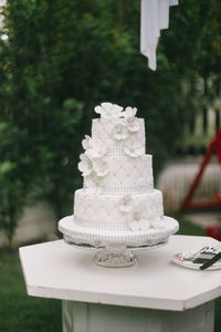 Close-up of weeding cake on table
