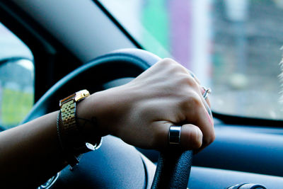 Close-up of man hand holding car