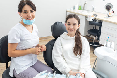 Orthodontist checking brackets on female teeth. concept of stomatology, dentistry, orthodontic