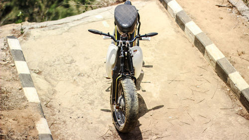 High angle view of bicycle on footpath