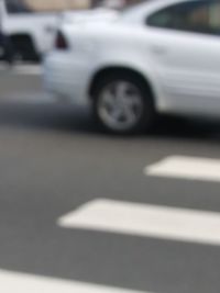 Close-up of vintage car on road