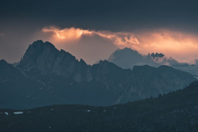 Scenic view of mountains against sky during sunset