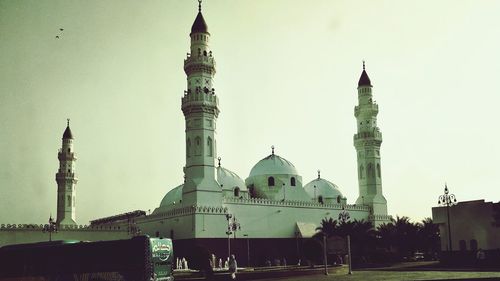 View of buildings in city against clear sky