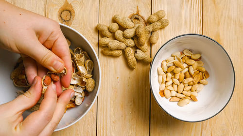 Cropped hand of person preparing food